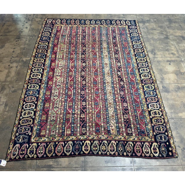 A striking antique Karabagh rug dating to circa 1850, woven in the Caucasus region. This exceptional mid 19th century...