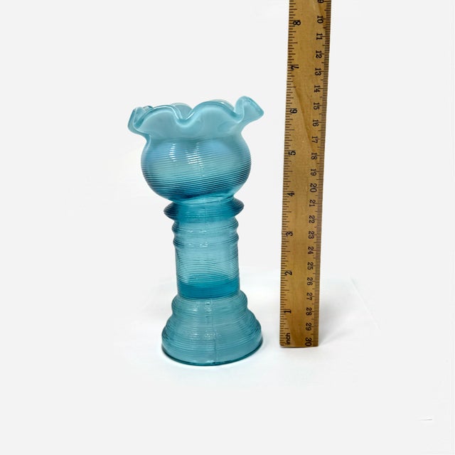 Add a touch of early 20th-century charm to your collection with this gorgeous Jefferson Glass Company No. 73 "Spool" vase....