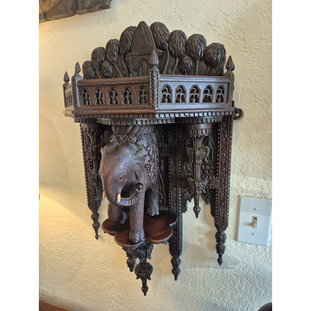 Impressive antique Moroccan wall braket handcrafted in mahogany, featuring a gallery around the shelf,carved palm...