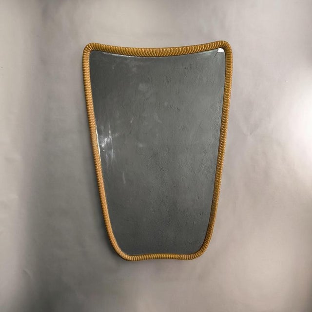 Curved mirror in the style of Gio Ponti, an Italian design from the 1950s. Knurled wooden frame, excellent vintage...