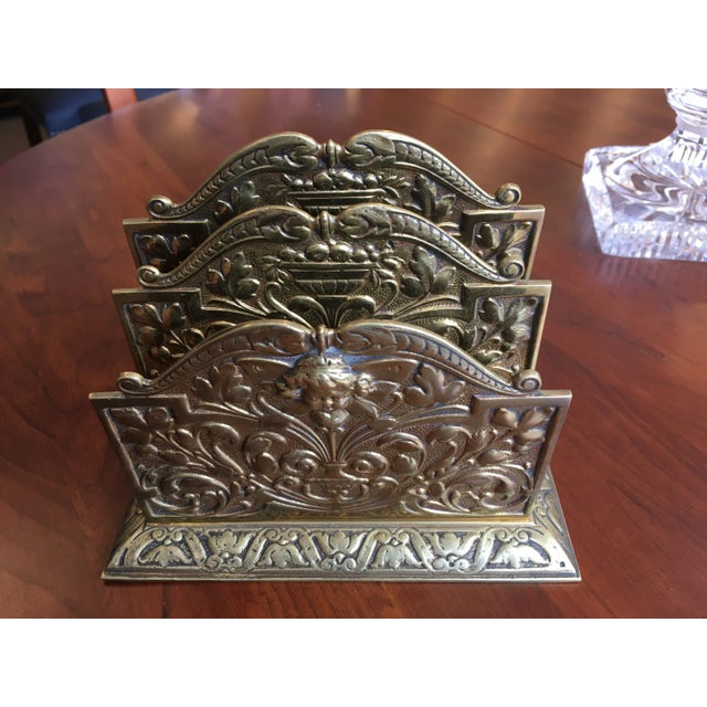 Antique brass three slot letter holder with cherub on front. Made in the 1910s.