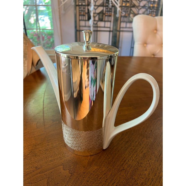 Up for consideration is a beautiful white ceramic creamer cup with a silver plate cover. This would look lovely in your...