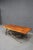 Striking mid-century organic modern coffee table featuring a live edge plank top paired with a sculptural iron branch-form...