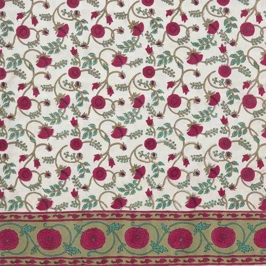 The Gina design draws upon Mughal influences, featuring a floral vine pattern in magenta pink on cream. A stately border...