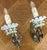 A beautiful pair of Vintage French sconces featuring ornate brass wall mounts combined with elegant decorative porcelain...