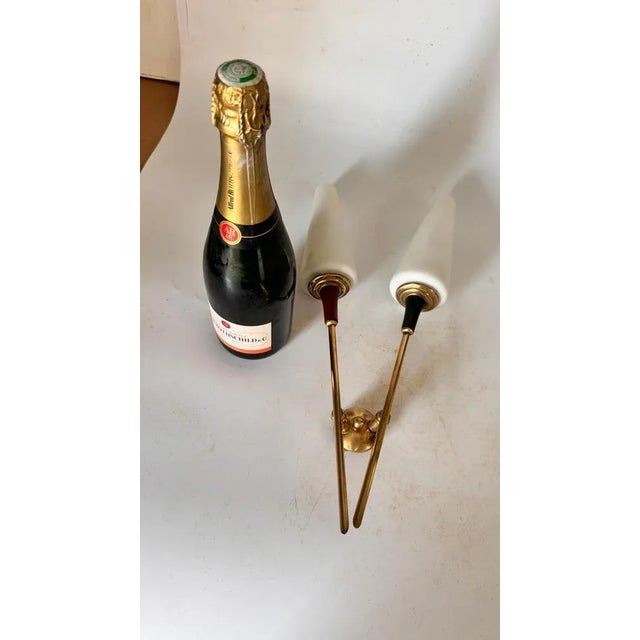 Arlus Style Sconce with two -branch opaline lampshades 1960s. Up to 250V (Europe/UK Standard).The wiring of this item may...