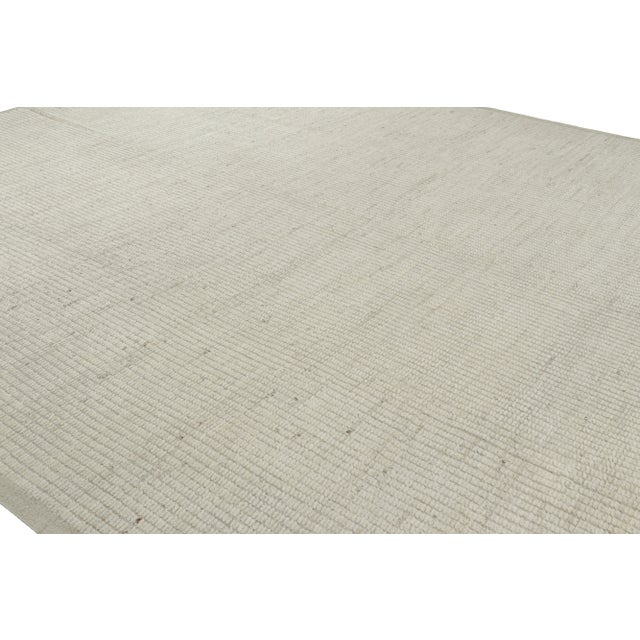 Hand-knotted in wool, this 14x16 oversized rug originating from Afghanistan is a bold new addition to Rug & Kilim’s...