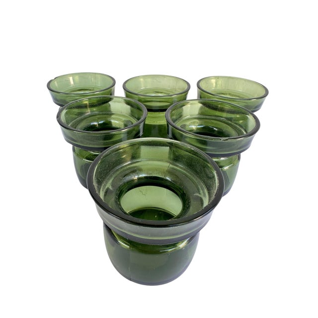 Own a piece of design history with this set of six (6) vintage green glass candle holders. These are not just generic...