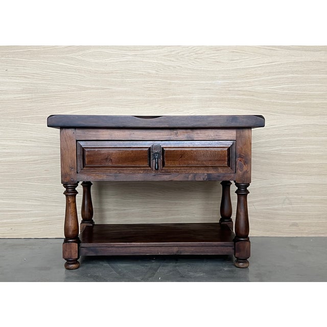 20th century Pair of Spanish nightstands or large low tables with one drawer , iron hardware and low shelve. The table has...