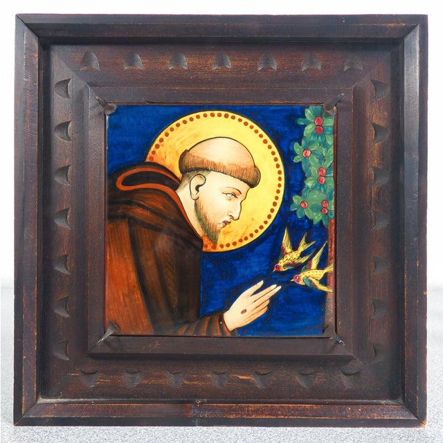 Pair of painted ceramic tiles by serafino volpi deruta, saint francis and saint clare, wooden frames. Italy, 1920s origin...