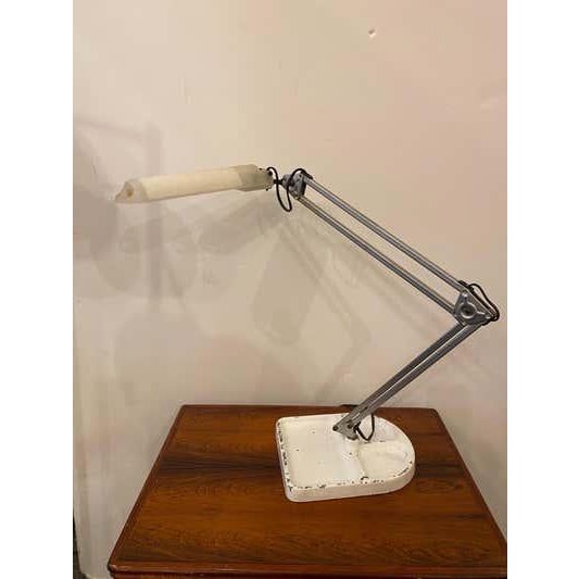 1970's Lival Finland Task Lamp, possibly from Ikea. Heavy Iron base shows paint loss. Metal pole of lamp sits in the base....