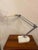 1970's Lival Finland Task Lamp, possibly from Ikea. Heavy Iron base shows paint loss. Metal pole of lamp sits in the base....
