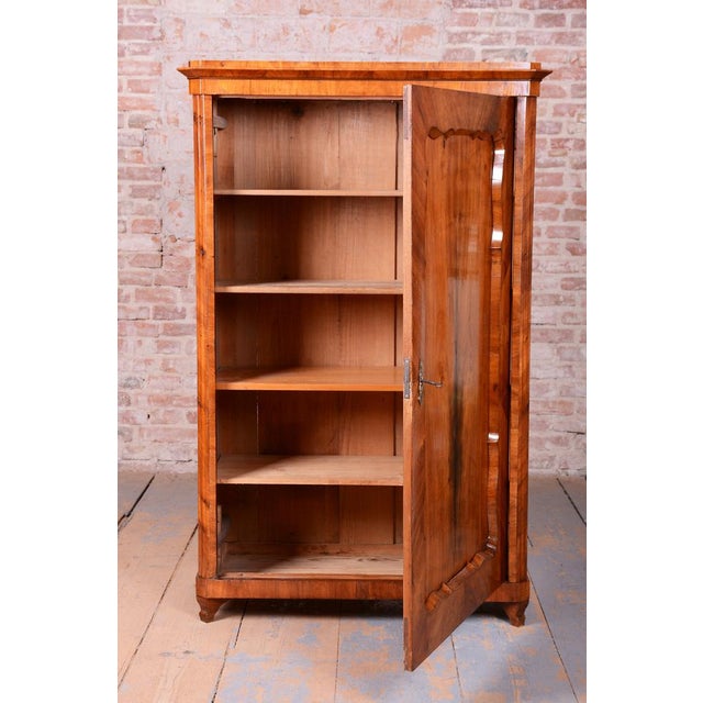 This monumental wardrobe is a masterclass in Viennese Biedermeier from the early 19th century. Its appearance is defined...