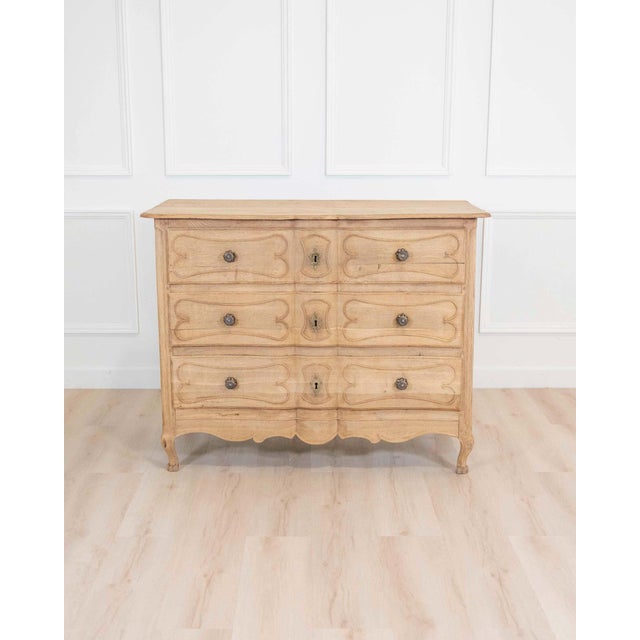 A refined French 18th century chest of drawers, beautifully crafted in natural oak and retaining a soft, sun-washed patina...