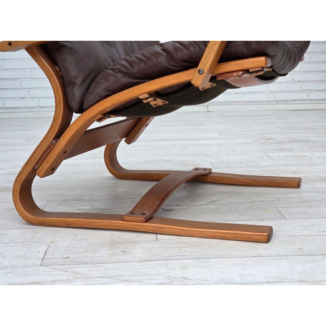 1970s, Danish armchair. Brown furniture leather, canvas, bent wood. Original very good condition: no smells, no stains and...