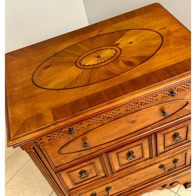 Attractive pine three drawer storage chest with pull out writing surface and inlaid top.Dovetail drawer construction,...