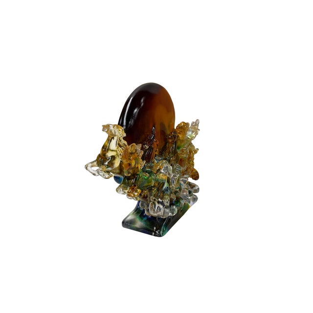 This magnificent crystal glass sculpture captures a dynamic scene of wild horses galloping furiously across turbulent,...