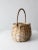 This is a vintage woven basket. The white-washed splint weave basket features a bentwood handle.