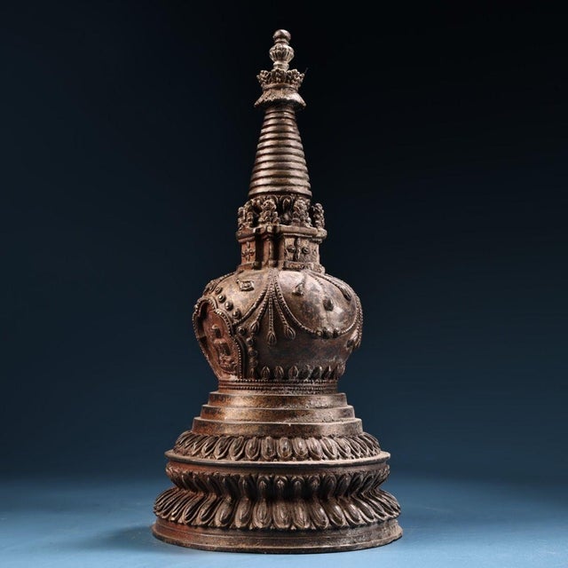 This is an exquisite antique gilt copper stupa, a revered architectural and devotional object in Tibetan Buddhism. The...