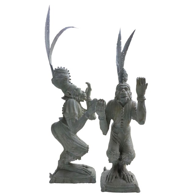 A pair of playful juggling monkeys made of resin. Resting upon a sturdy base measuring 14.5" x 11", these playful...