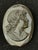Antique black mourning cameo in French jet glass. Has c-clasp. Measures 1.75” x 1.5”.