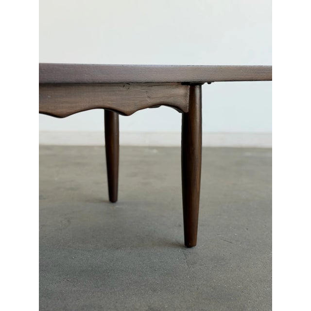 W54 D20 H15 A beautifully refinished vintage coffee table that blends clean lines with playful, handcrafted detail. We...