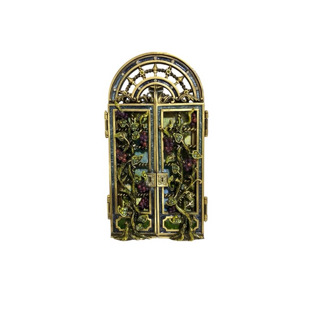 This is a rare, hard to find Jay Strongwater Magnolia Enchanted Trellis picture frame with two hinged gates in an...
