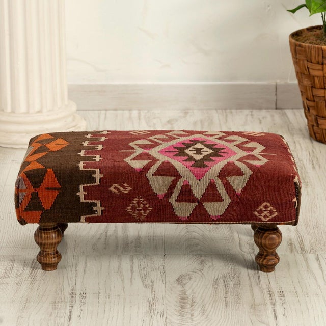 This handcrafted footstool brings the rich weaving traditions of Anatolia into contemporary interiors. The upholstery...