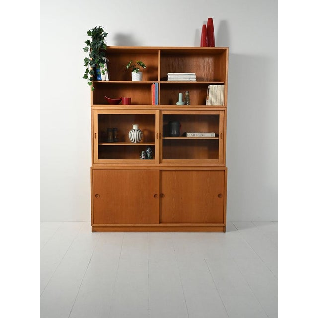 Designed by Børge Mogensen for Karl Andersson & Söner, 1960s. Oiled oak, three modules: base unit with sliding doors,...