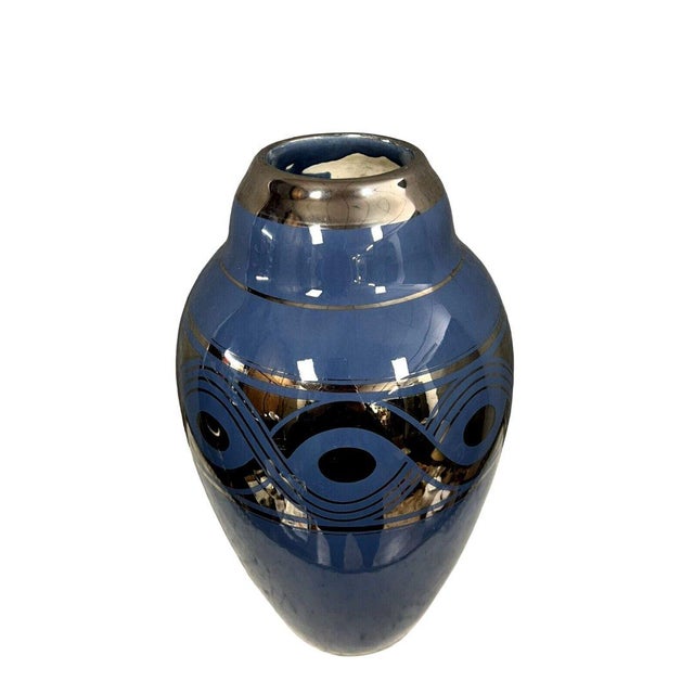 Large Art Deco porcelain vase decorated with silver geometric shapes on a blue background, circa 1930. Height: 39 x 22 cm