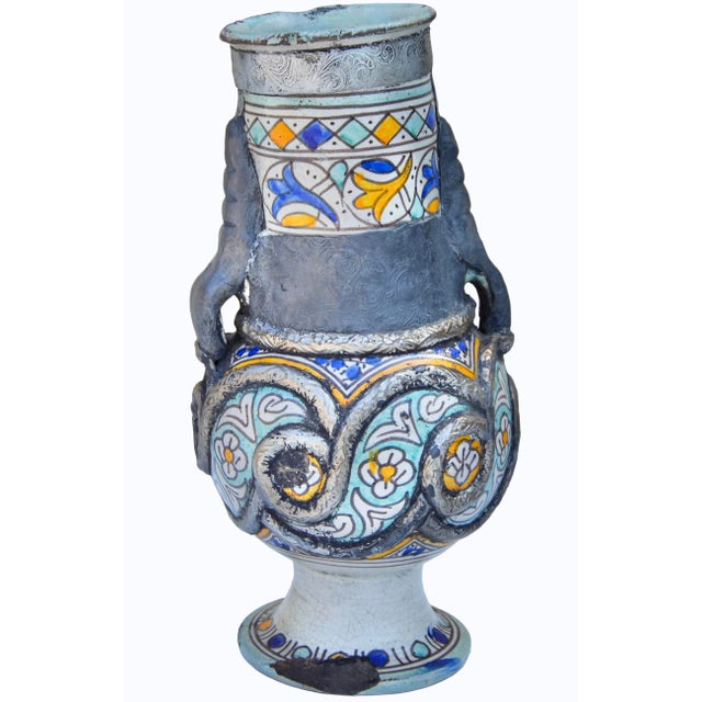 This spectacular Early 19th Century one-of-a-kind Moroccan ceramic vase with handles, is a sure way to make an elegant...