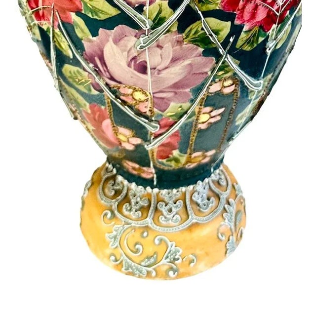 A pair of Moriage Nippon Style Double Handled Vases. These vases have exquisite Nippon style; it features a beautiful...