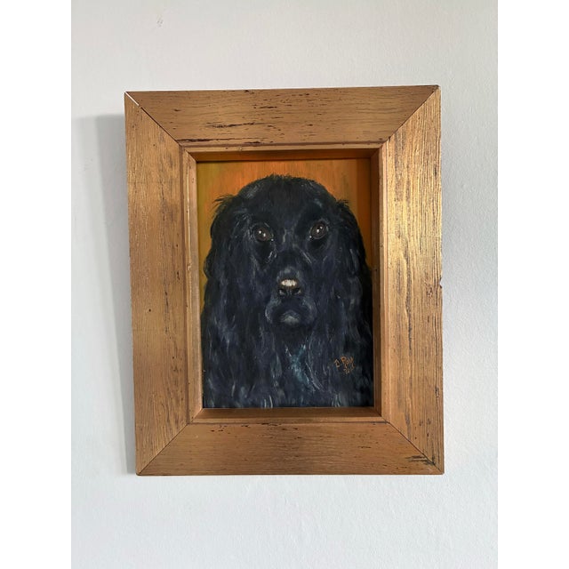This original pair of vintage dog portrait oil paintings, dated 1972, shows two long-haired spaniels captured in matching...