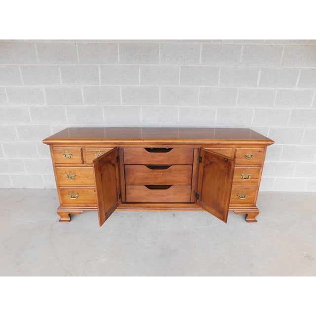 Thomasville Fisher Park Pecan Wood Dresser 75"W Features quality crafted solid Wood construction, 9 Drawers, Brass Pulls,...