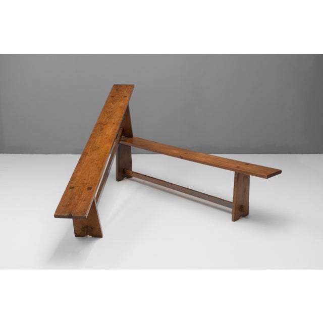 Pair of early 20th century solid pine benches. Great aged patina with signs of old worm. Fully treated and restored....