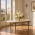 Grand Antique French Louis XVI Mahogany Dining Table with Carrara Marble Top a l’Etrusque brings together the refined...