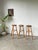 Set consisting of three old farmhouse high stools. Made from solid, hard wood, these stools have a round, thick seat....