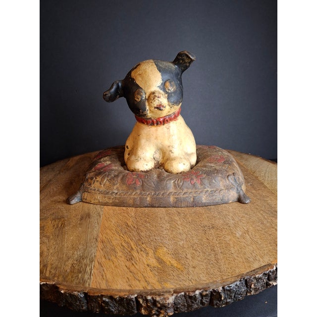 This is an authentic, large-scale antique cast iron still penny bank known as "Fido on Pillow," manufactured by the...