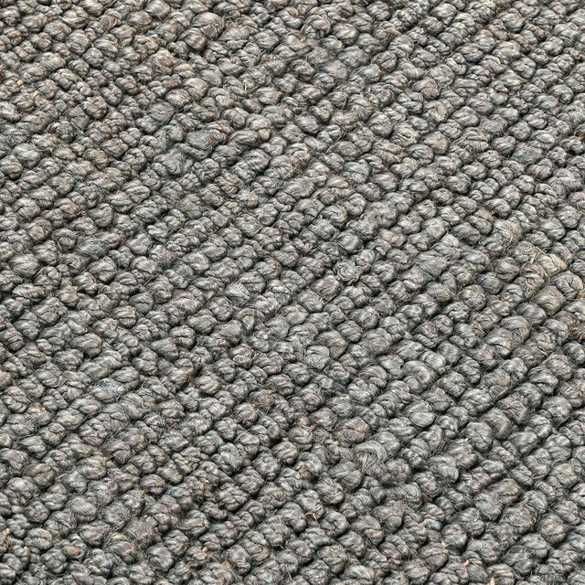 Boucle style weave 100% jute rug in a soft neutral oat color. Available in numerous sizes. Please note that its appearance...