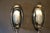 This pair of sconces in crystal glass features 3 glass panels mounted on a chromed metal base. The first piece of glass is...