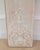 An elegant pair of antique French boiserie panels featuring beautifully carved Rococo-inspired ornamentation and a softly...