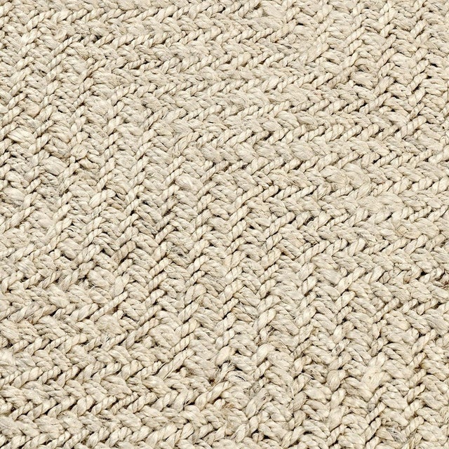 Hand woven jute and wool rug in bleached ivory tones. Stylish subtle chevron pattern. Available in numerous sizes. Please...