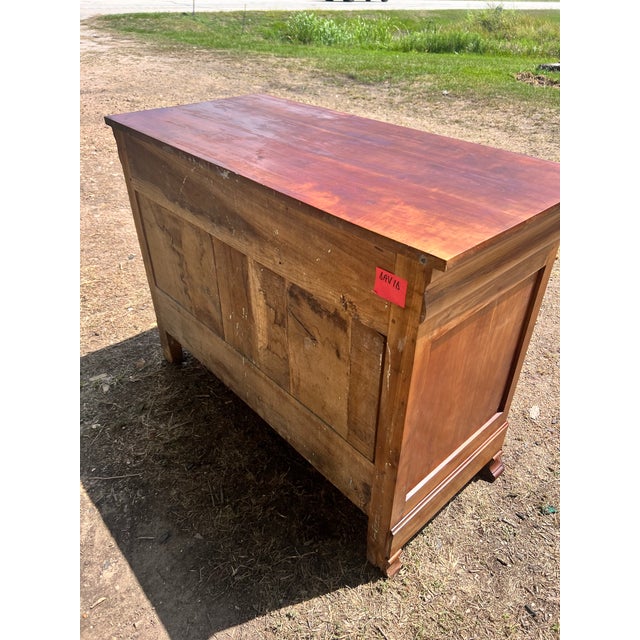 This elegant 19th-century French Louis Philippe commode is crafted from richly figured chestnut, showcasing a warm honey-...