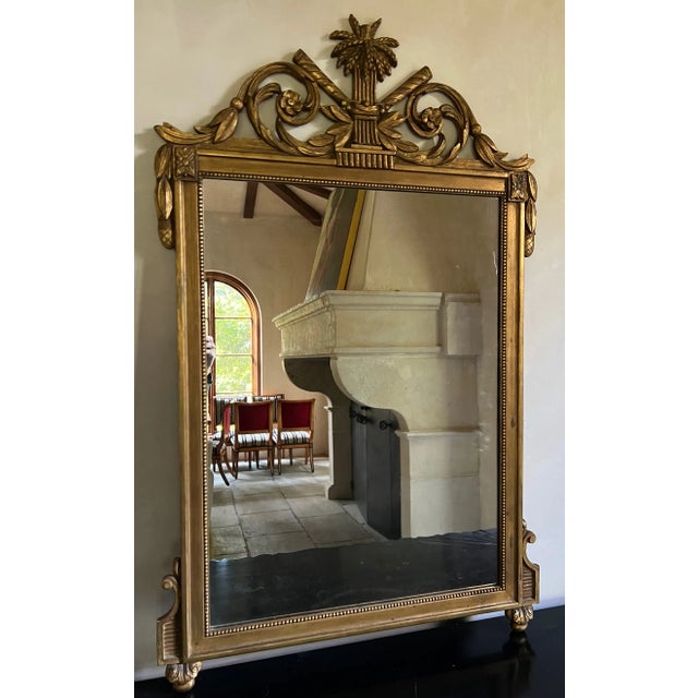 Vintage Decorative Arts, Inc., New York mirror in Louis XVI style with crowned with wheat, surrounded by leaves and...
