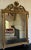 Vintage Decorative Arts, Inc., New York mirror in Louis XVI style with crowned with wheat, surrounded by leaves and...
