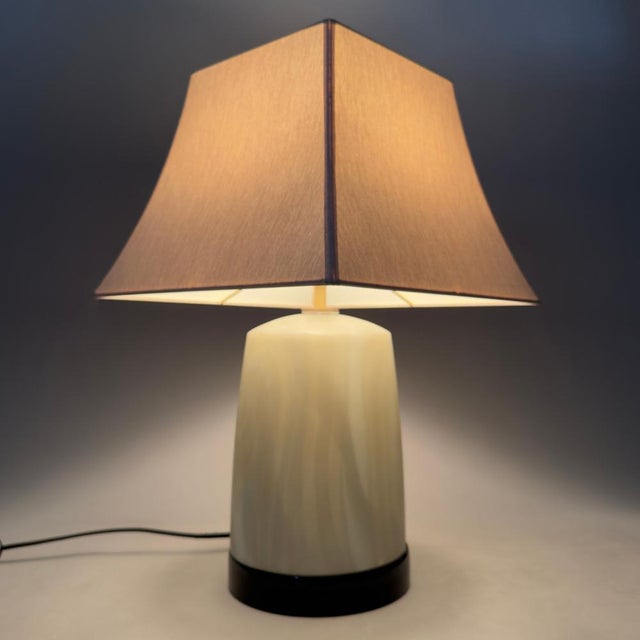 An exclusive and refined lighting solution for classy interiors. This rare "Visa" table lamp by G Luce is a sought-after...