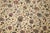Room size Indian rug with an all over floral design on an ivory ground. Border in deep green Mesures: 10' x 13'3''