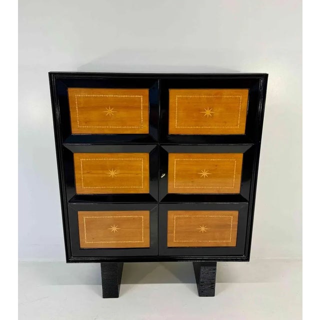 Elegant Art Deco cabinet produced in Italy in the 1950s and attributed to Osvaldo Borsani. The structure features black...