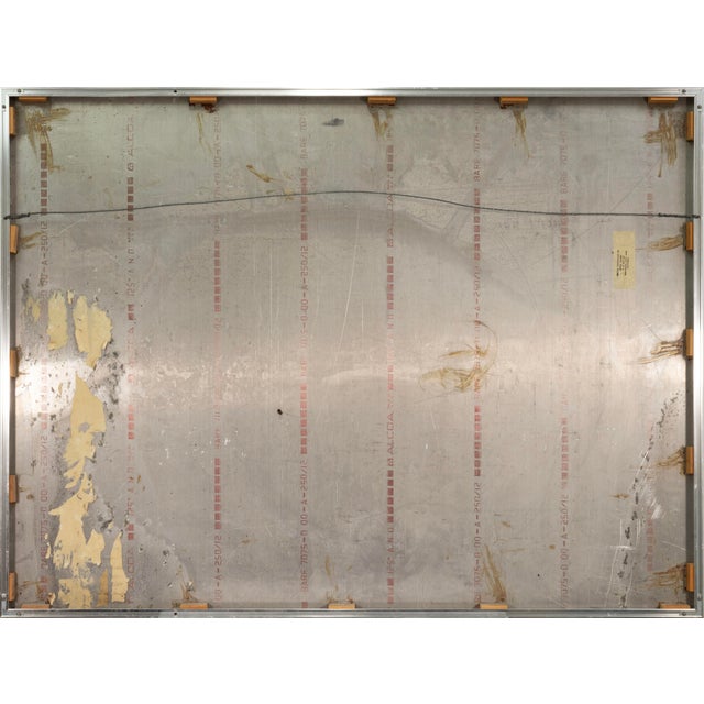 A sculptural wall work by Greg Clark featuring an elegant swirling composition rendered in silver-toned metal. Defined by...