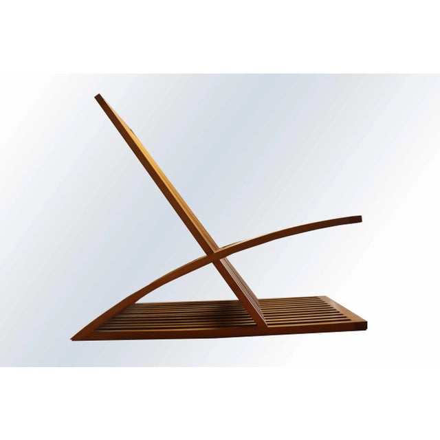 This Triclinia lounge chair by Masao Noguchi was designed in 1988 and produced by Meccani Arredamenti the same year. This...